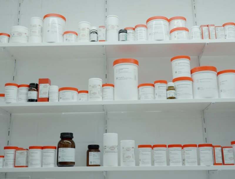 Pharmacy shelf stocked with medicine bottles